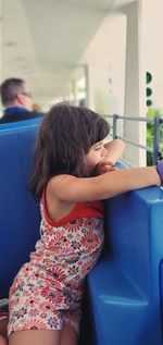 Girl standing on seat