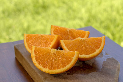 Close-up of orange slice on cutting board