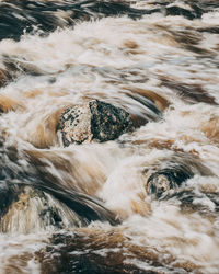 Scenic view of water flowing through rocks