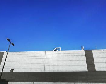 Low angle view of building against clear blue sky