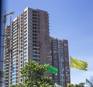 Low angle view of modern buildings against clear sky