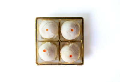 High angle view of bread on white background