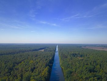Scenic view of landscape against blue sky