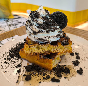 Close-up of cookies ice cream waffle  in plate on table