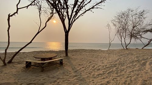 Scenic view of beach against sky during sunset