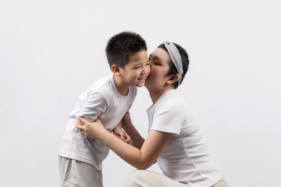 Happy friends against white background