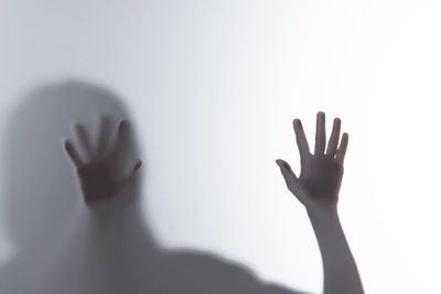 Close-up of hand against white background