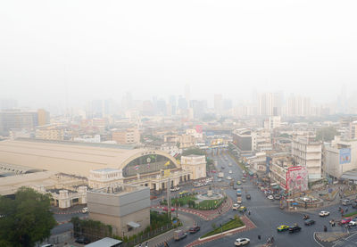 High angle view of buildings in city against sky