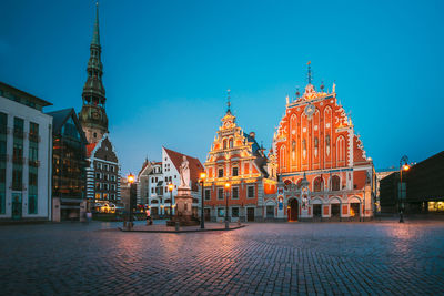 Buildings by river