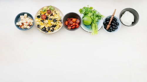 High angle view of breakfast on table against white background