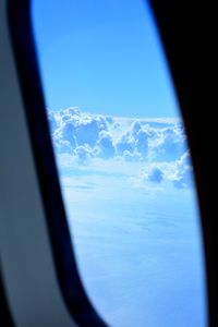 Close-up of airplane window against clear sky