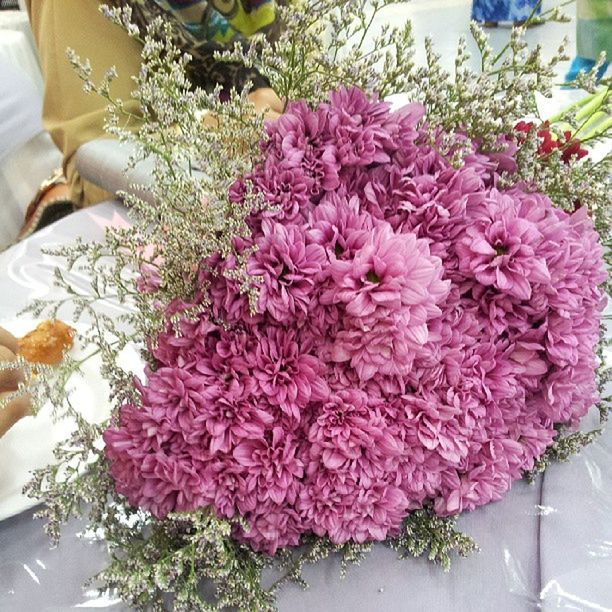 flower, freshness, indoors, fragility, petal, pink color, high angle view, close-up, bunch of flowers, bouquet, growth, plant, table, flower head, beauty in nature, potted plant, nature, decoration, vase, flower arrangement