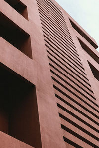 Low angle view of office building against sky