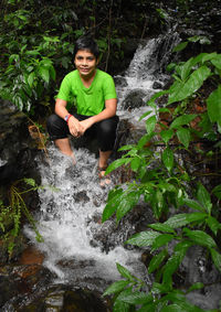 Portrait of man sitting in water