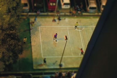 People playing soccer on field