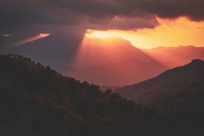 Scenic view of mountains against sky during sunset