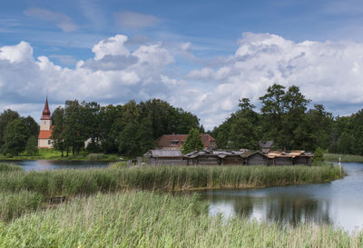 Scenic view of lake against cloudy sky