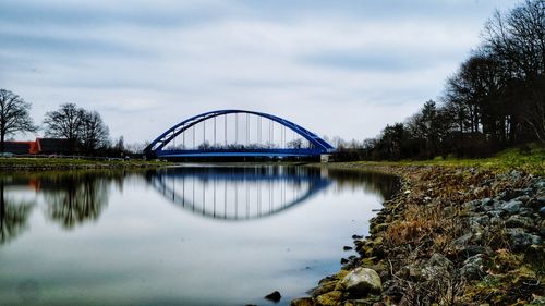 Bridge over river against sky