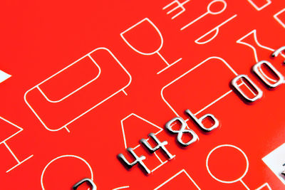 High angle view of text written on red background