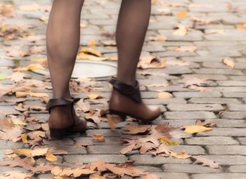 Full length of woman in autumn leaf