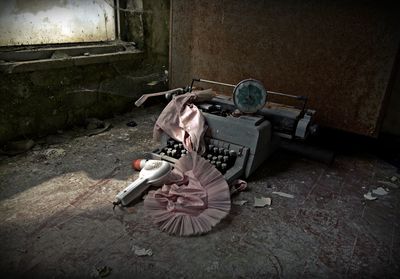 High angle view of old typewriter in abandoned house