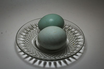 High angle view of eggs in plate on table