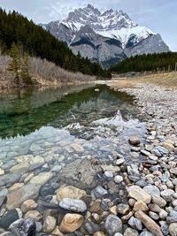 Reflected mountain peak in shallow water