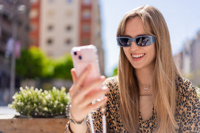 Young woman using mobile phone