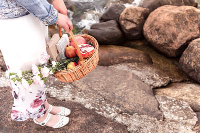 Low section of woman holding ice cream cone