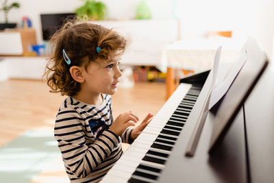 Young woman playing piano