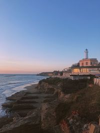 Scenic view of sea against clear sky during sunset