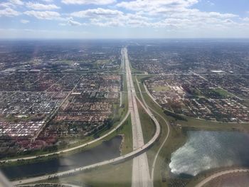 High angle view of river amidst buildings in city