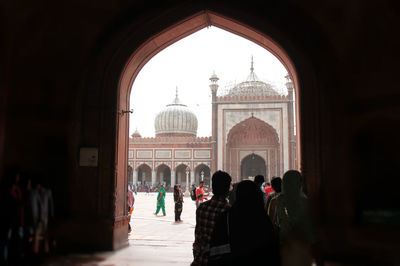 Group of people in front of historical building