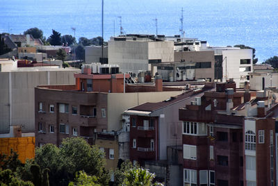 High angle view of residential buildings against clear sky