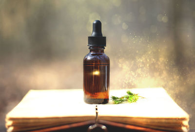 Close-up of glass bottle on table