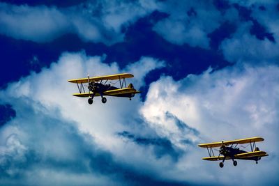 Low angle view of airplane against sky
