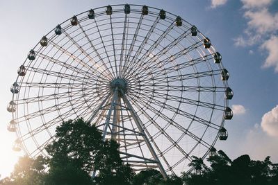 Low angle view of ferris wheel against sky