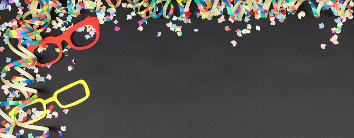 High angle view of colorful confetti on table