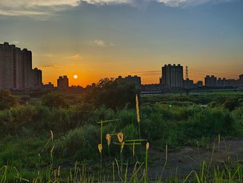 Buildings against sky during sunset