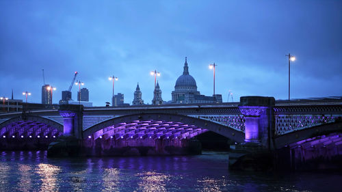 Illuminated blackfriars bridge in london at night