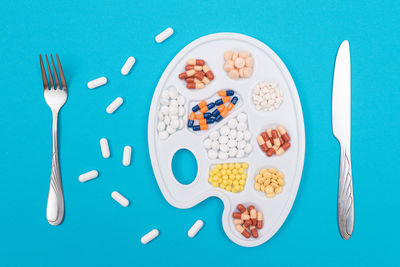 High angle view of breakfast on table against blue background