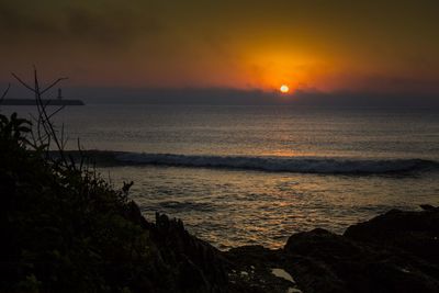 Scenic view of sea against sky during sunset