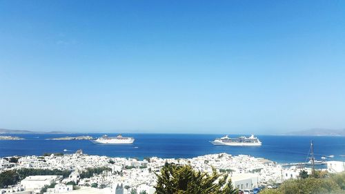 High angle view of ship sailing in sea against clear sky