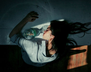 Young woman sitting in bathtub