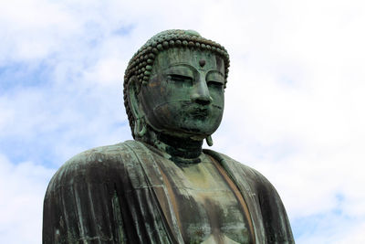 Low angle view of statue against sky