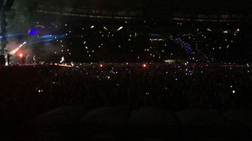 Crowd at music concert at night