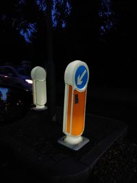 View of illuminated street light against trees at night