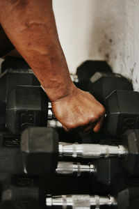 Cropped image of man exercising in gym