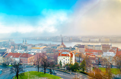 High angle view of buildings in city against sky