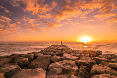 Scenic view of sea against sky during sunset